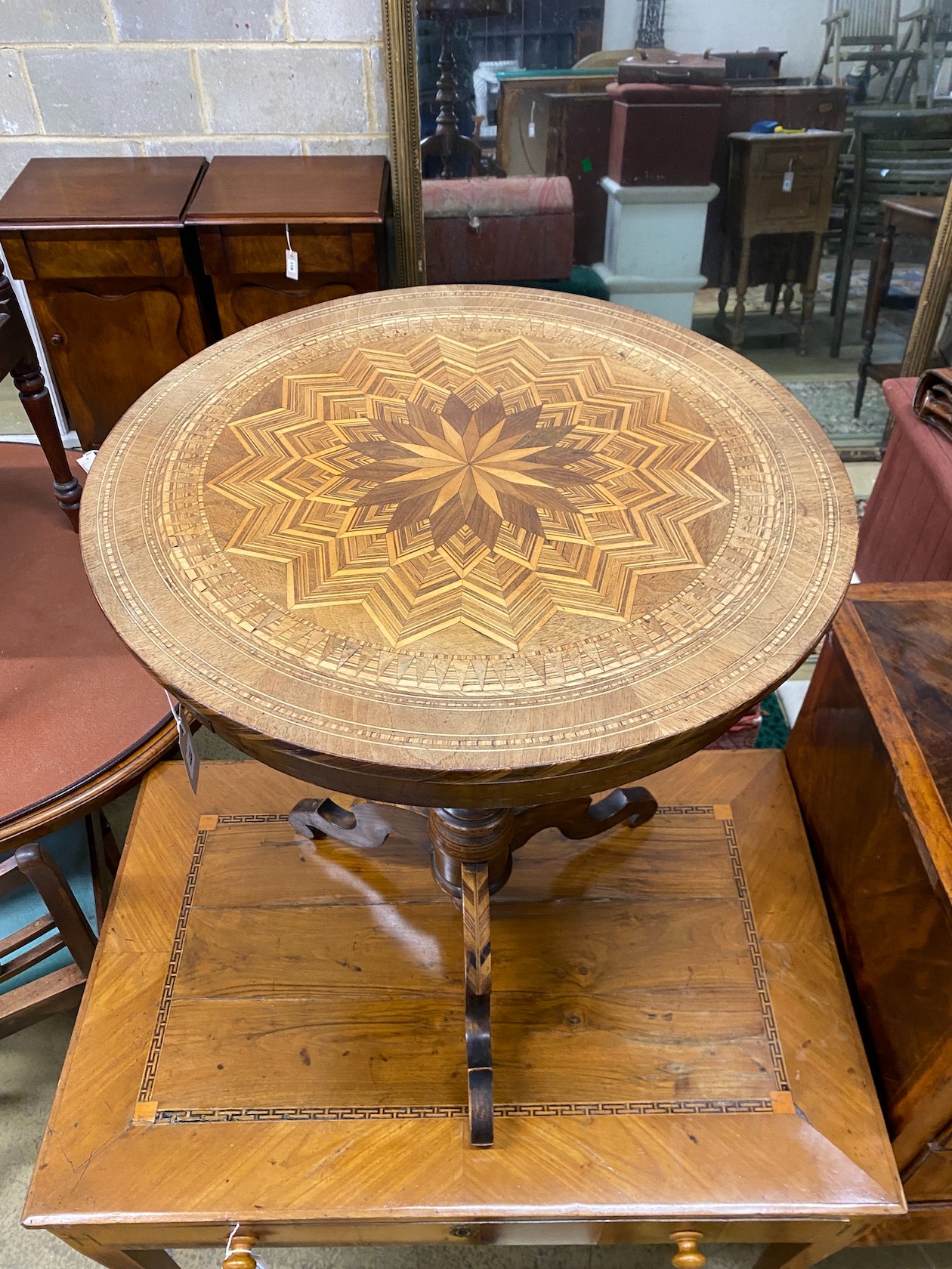 An early 20th century French circular parquetry inlaid tripod table, diameter 51cm, height 71cm.